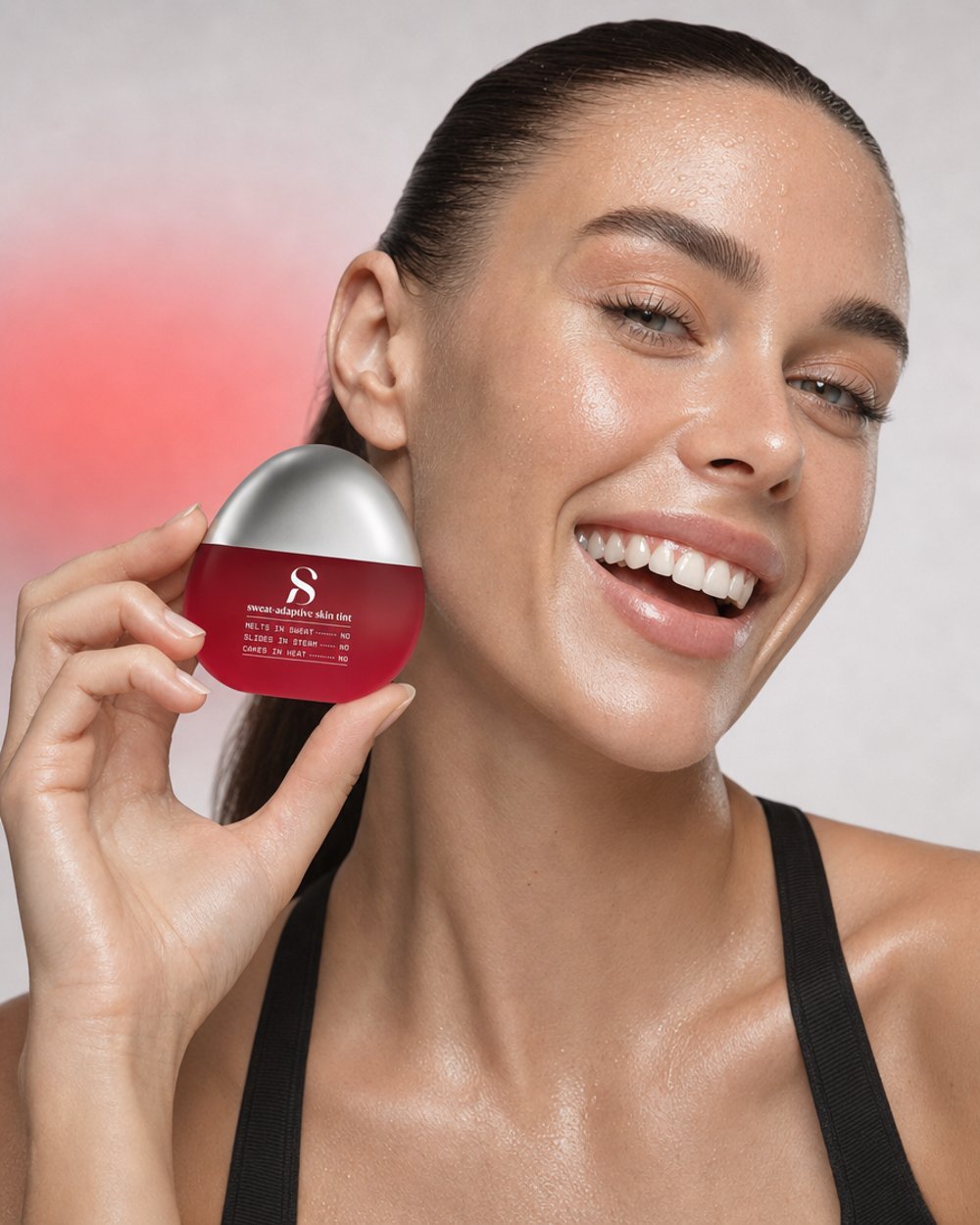A woman mid-workout holding the Stamina compact, smiling